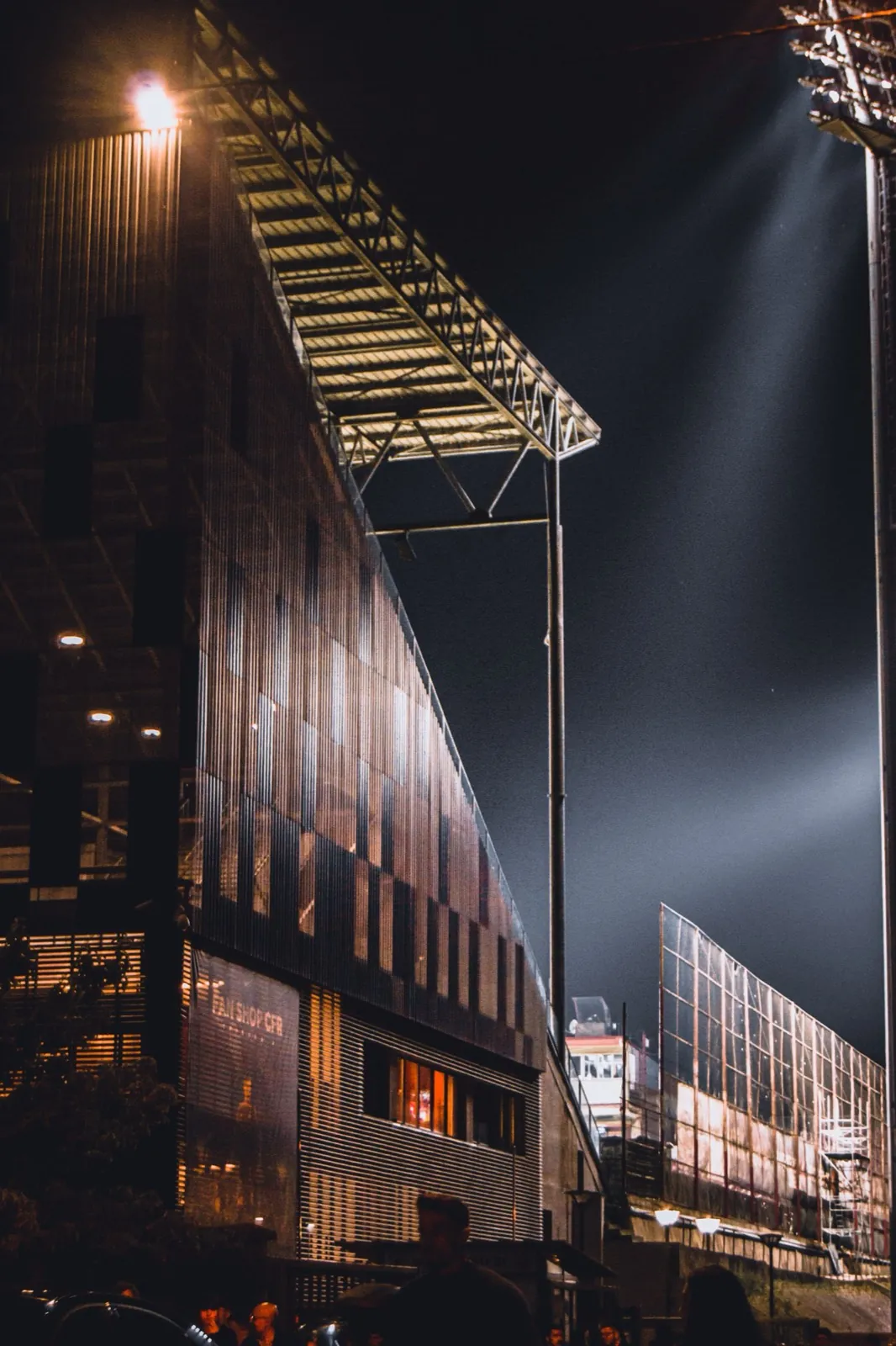 Football stadium floodlights at night